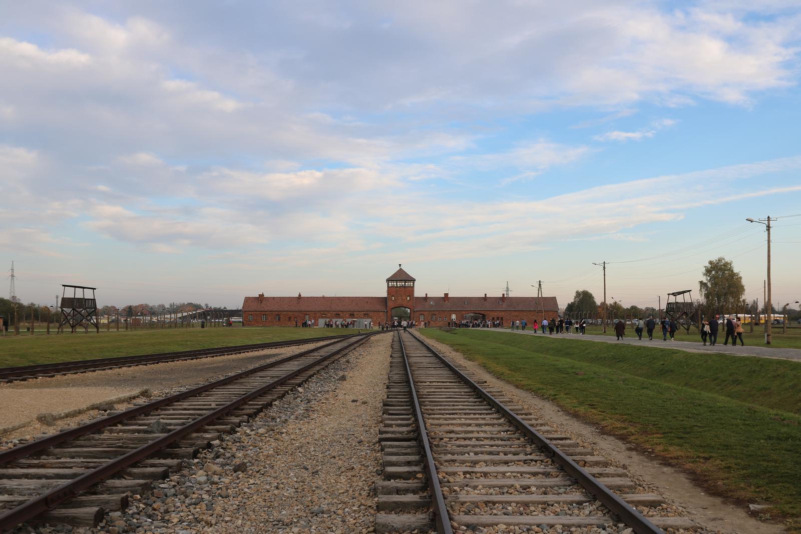 Railroad tracks leading to the gatehouse of Auschwitz-Birkenau Memorial and Museum, a UNESCO World Heritage Site