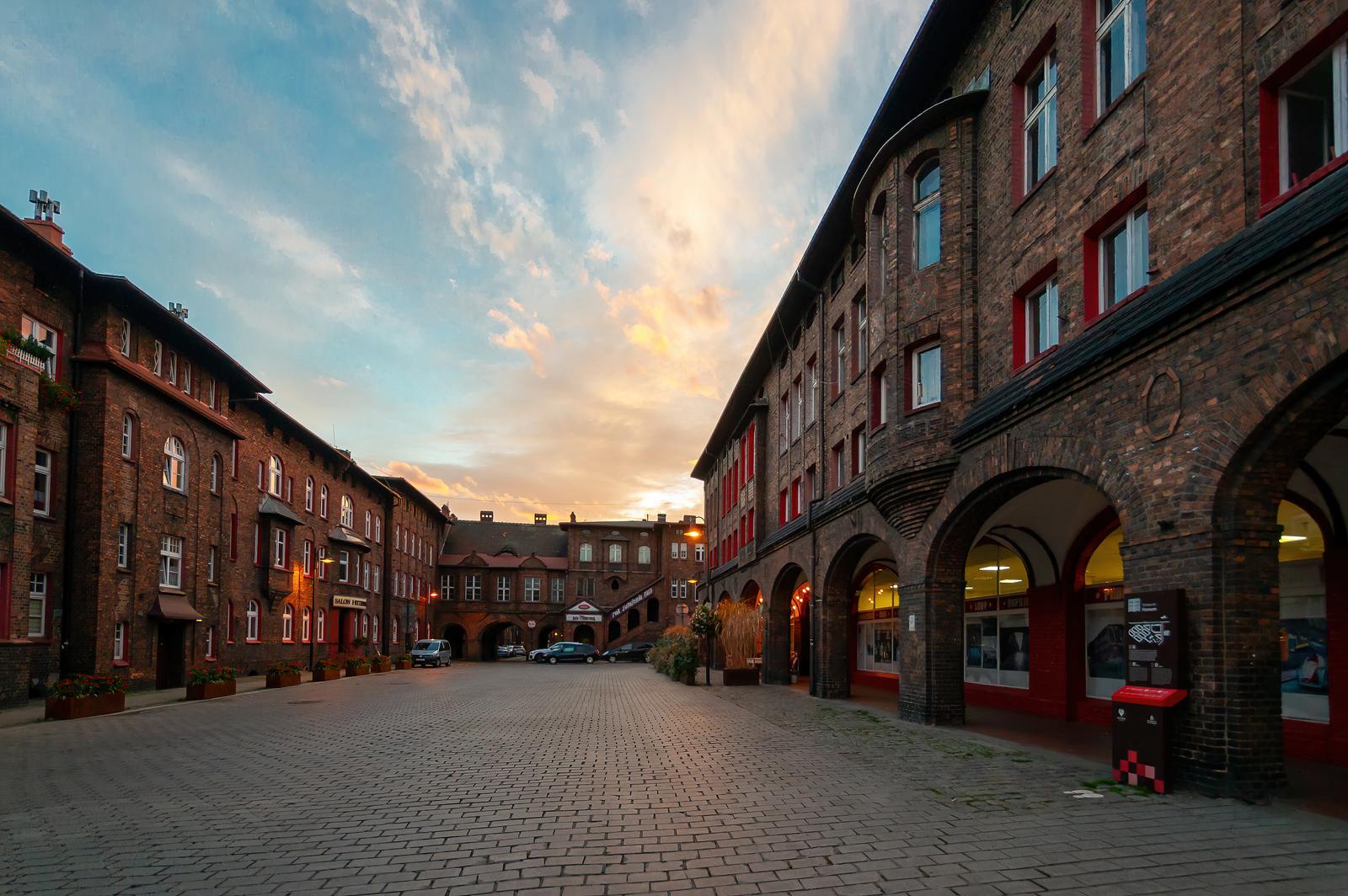 Plac Wyzwolenia square in historic Nikiszowiec at dusk, red-brick miners' estate in Katowice