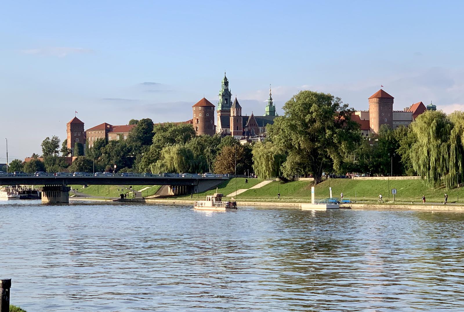 Wawel Castle on its hill seen from across the Vistula River on a summer afternoon