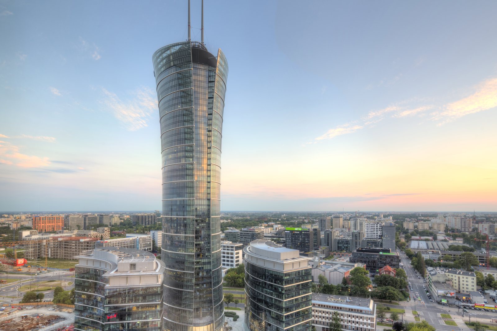 Warsaw Spire and the Wola business district from the air at golden hour