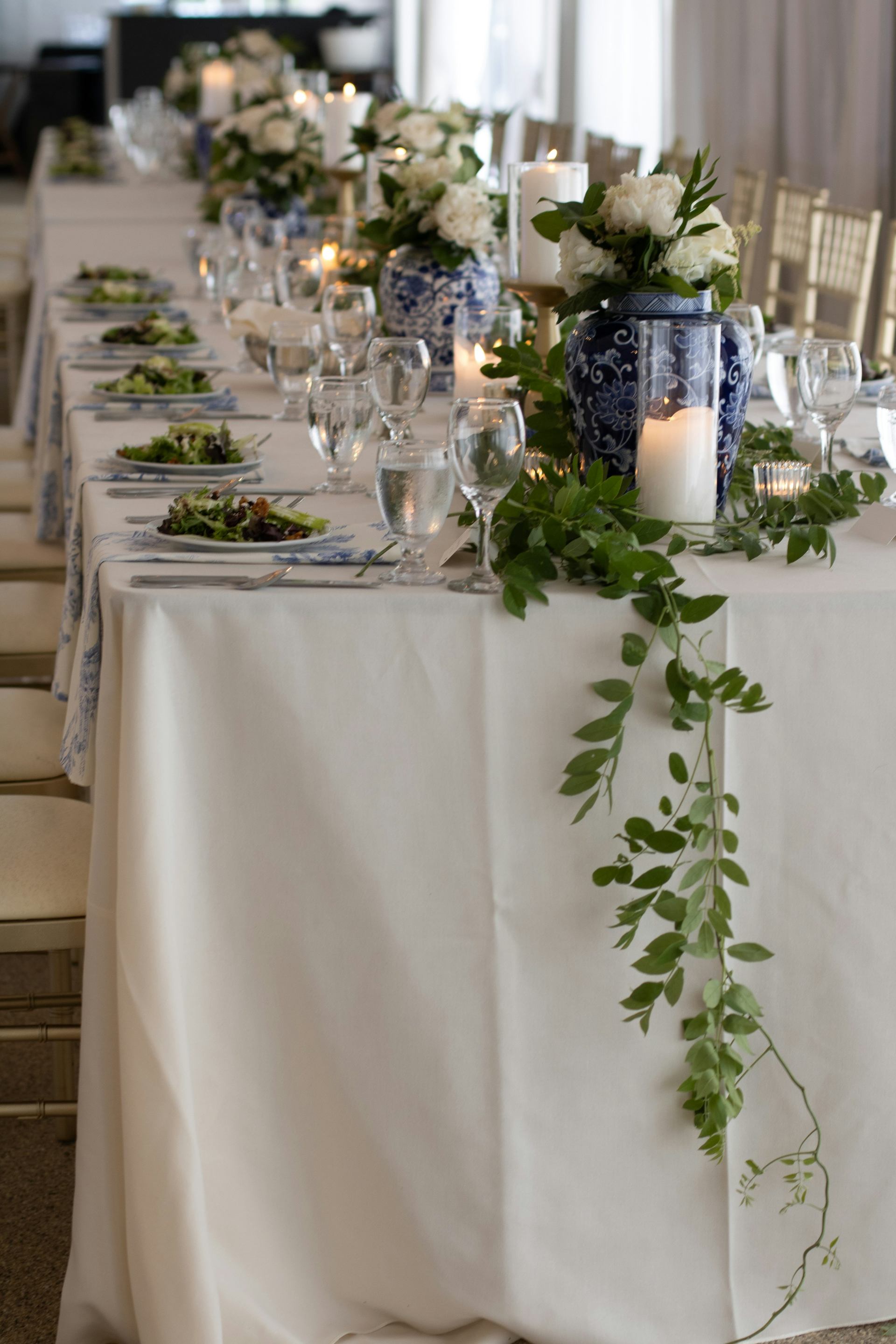 Elegantly set event reception table with white flowers and candles